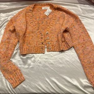 pinkyotto small orange crop sweater
